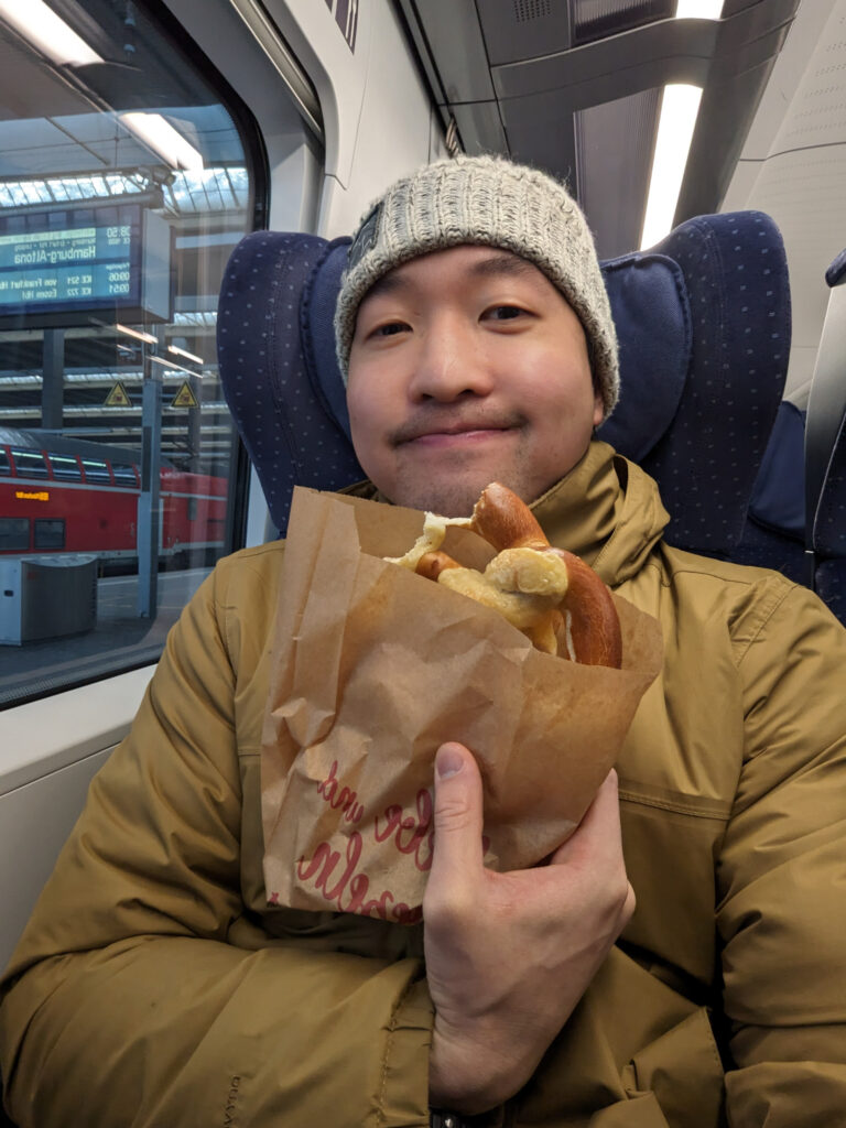 Eating a Pretzel on the ICE Train from Munich to Nurember, Photo by Alex Lau