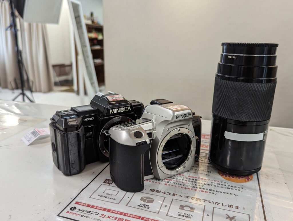 Minolta bodies and beercan lens, purchased at Lemon Camera, photo by Alex Lau