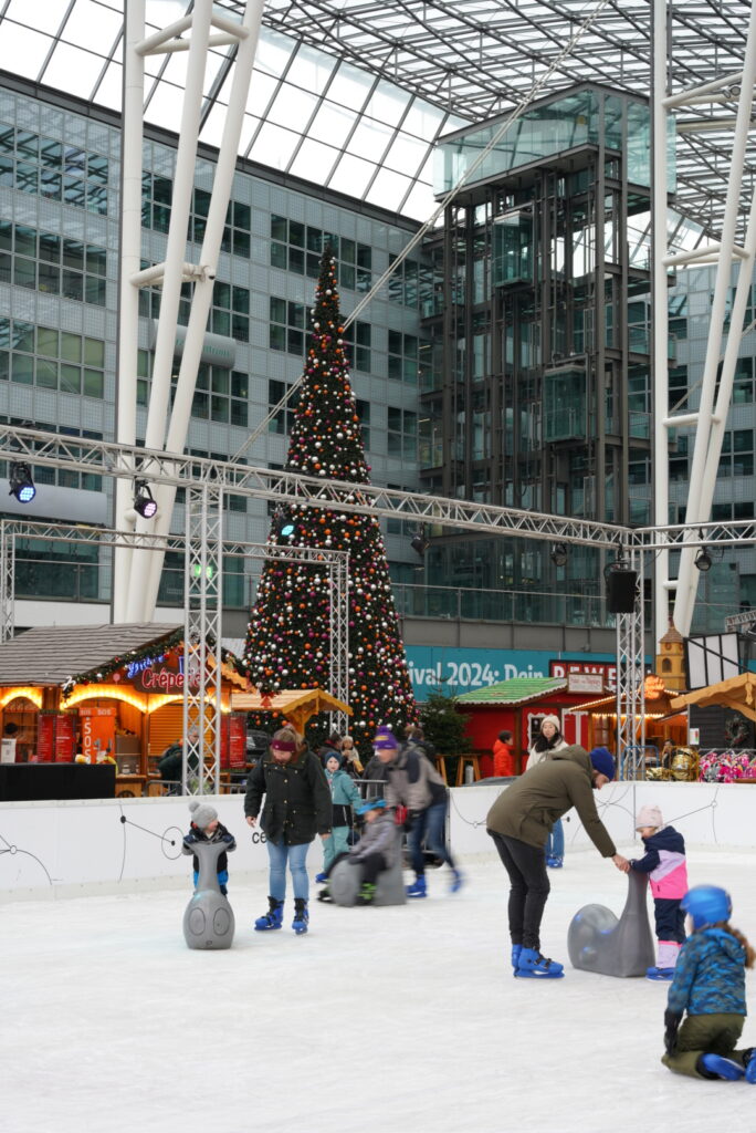 Christmas Market outside of Munich Airport with Christmas Tree Lit Up, photo by Alex Lau