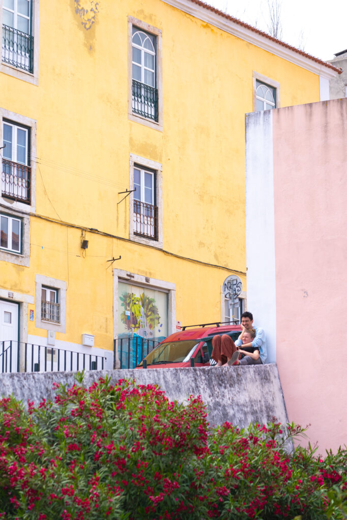 A couple hugging in Alfama in Lisbon Portugal, photo by Alex Lau