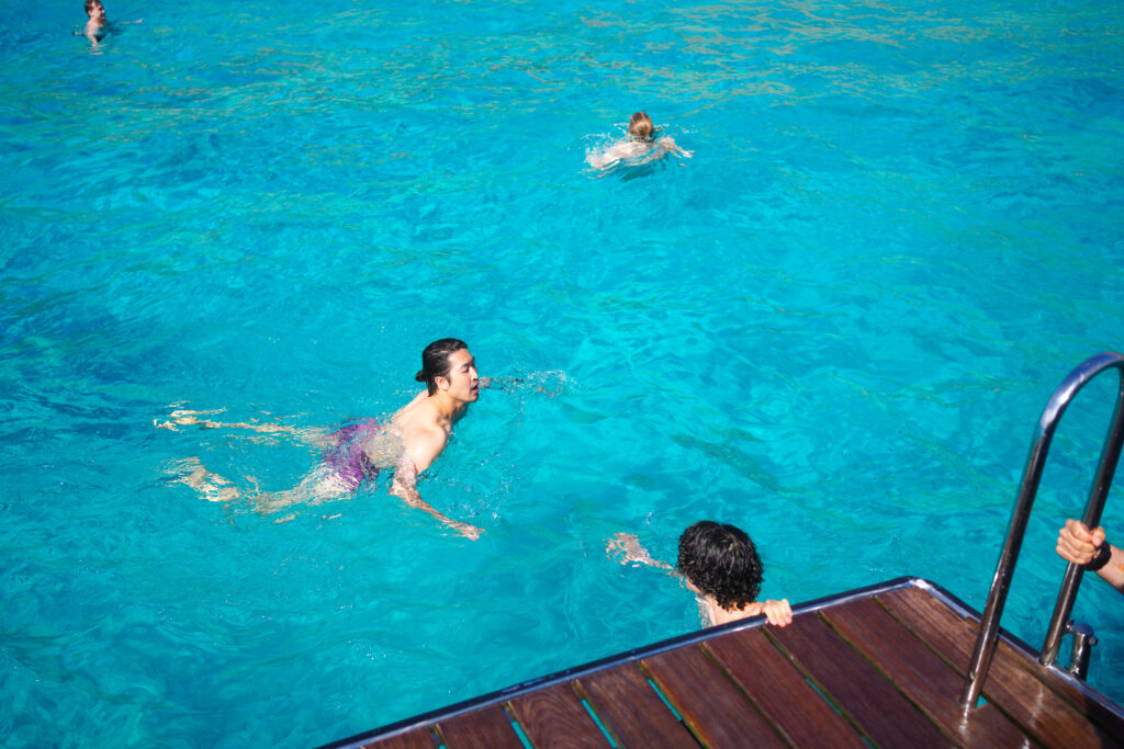 Diving into the water during Palma Bay Boat Tour and Snorkel in Spain by Sa Calma Boats, photo by Alex Lau