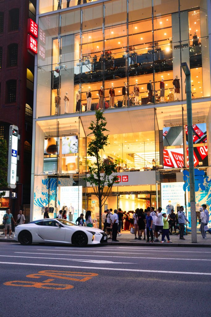 Ginza uniqlo and luxury car photo by Alex Lau